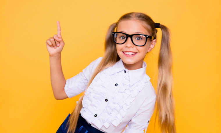Back to school! First grade junior lifestyle teen concept. Close up studio photo portrait of cute girl gesturing up wearing trendy blouse white outfit isolated bright shine background